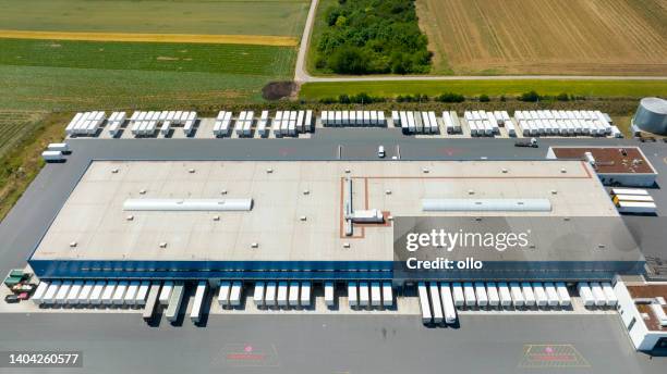 distribution logistics building parking lot - overhead power line stock pictures, royalty-free photos & images