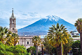 Tower on the background of a volcano in Arequipa, Peru.