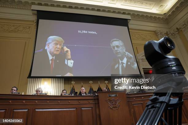 Transcript of a phone call between former U.S. President Donald Trump and Brad Raffensperger, Georgia Secretary of State, appears on a video screen...