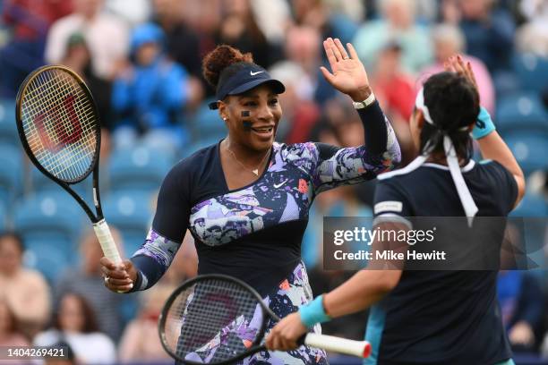 Serena Williams of United States of America and Ons Jabeur of Tunisia celebrate after their victory over Marie Bouzkova of Czech Republic and Sara...