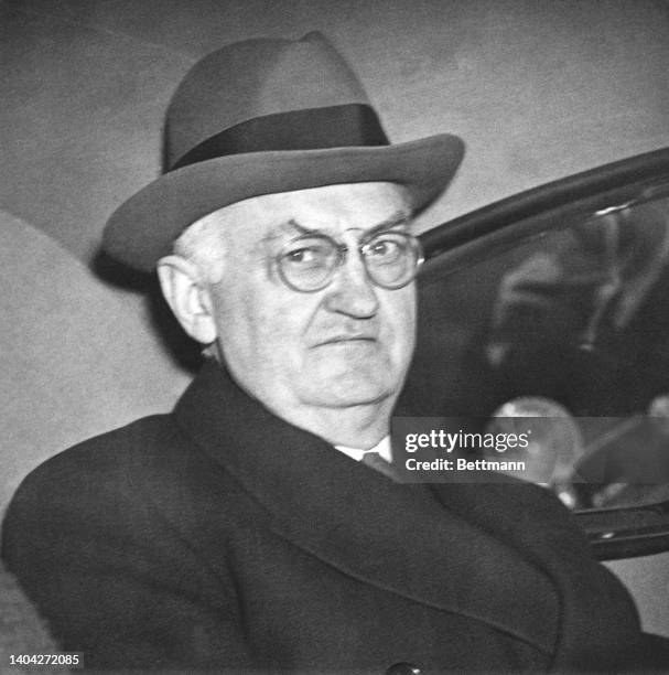 The former presiding Judge of the United State Circuit Court of Appeals is shown in his car shortly after his arraignment today in Federal Court on...