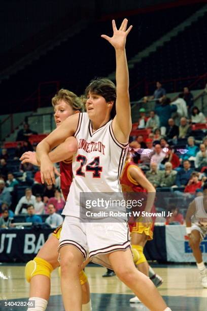 The University of Connecticut's Kerry Bascomb calls for the ball, while posting up an opposing player, Gampel Pavilion, Storrs, CT, 1991.