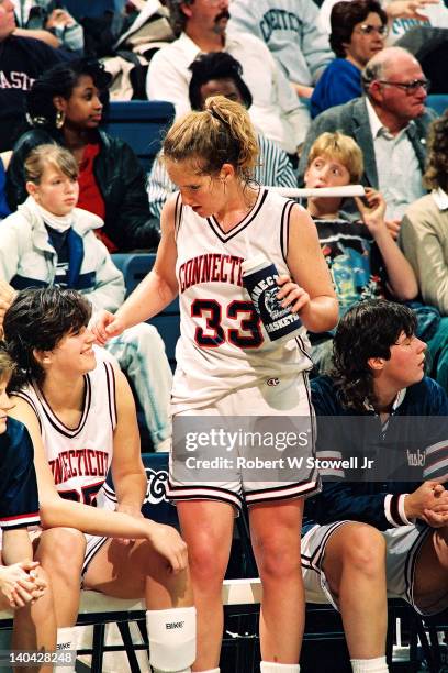 University of Connecticut's Meghan Pattyson takes a break on the team bench during a game against Iowa, Gampel Pavilion, Storrs, CT, 1991.