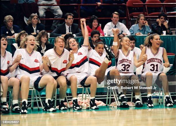 The University of Connecticut bench celebrates during the last seconds of the championship game victory against the University of Tennessee,...