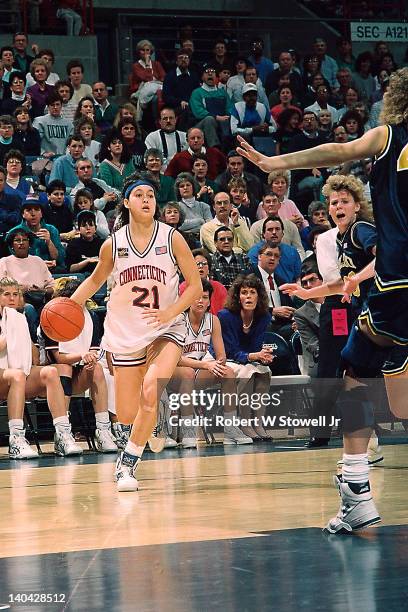 View of University of Connecticut's Orly Grossman as she dribbles up for a jumper against the University of Iowa, Gampel Pavilion, Storrs, CT, 1991.