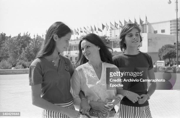 Spanish singer Miguel Bose with his mother Lucia Bose and his sister outside the Movie Palace, Lido, Venice, 1972.