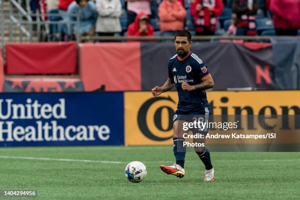 DeLaGarza of New England Revolution passes the ball during a game between Minnesota United FC and New England Revolution at Gillette Stadium on June...