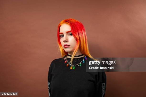 studio portrait of an 18 year old woman with dyed hair - pink haired girls bildbanksfoton och bilder
