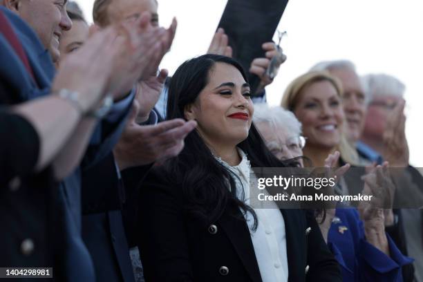 Rep. Mayra Flores is applauded by House Republicans at a news conference after being sworn in at the Capitol Building on June 21, 2022 in Washington,...