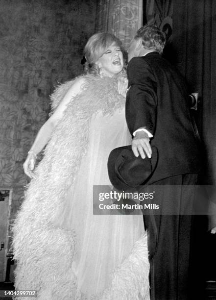 American comedienne, actress, singer and businesswoman Edie Adams gets a kiss from American actor, dancer, singer, vaudevillian and stage performer...