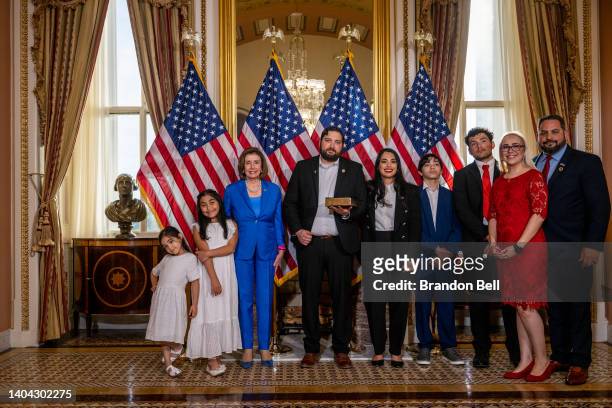 Congresswoman-elect Mayra Flores stands with her family and Speaker of the House Nancy Pelosi for a portrait after being sworn-in on June 21, 2022 in...