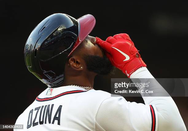 Marcell Ozuna of the Atlanta Braves reacts after hitting a two-run homer in the second inning against the San Francisco Giants at Truist Park on June...