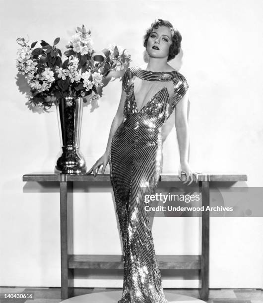 Nancy Carroll wearing a gown that was used in the film, 'The Woman Accused, Hollywood, California, 1933.