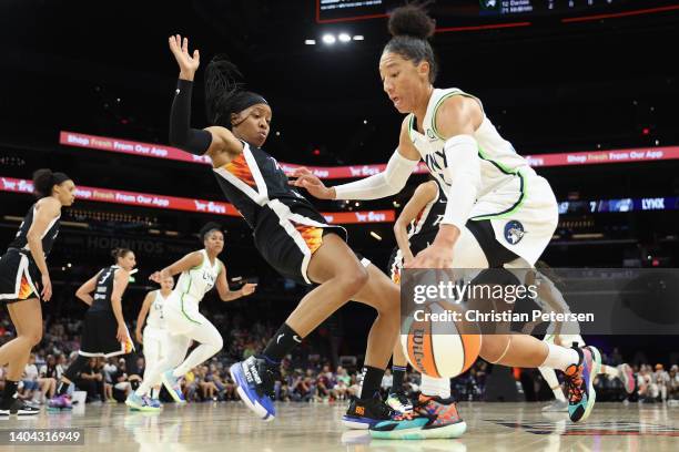 Aerial Powers of the Minnesota Lynx handles the ball against Shey Peddy of the Phoenix Mercury during the first half of the WNBA game at Footprint...