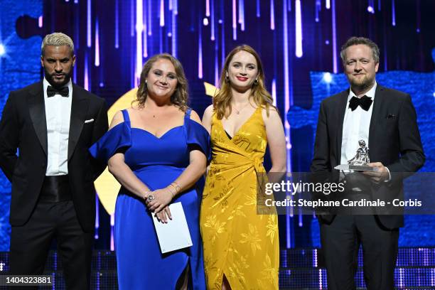 Danielle MacDonald, Catriona Renton and Producer Harry Williams pose with the BetaSeries Public Prize Award for 'The Tourist' next to Ricky Whittle...