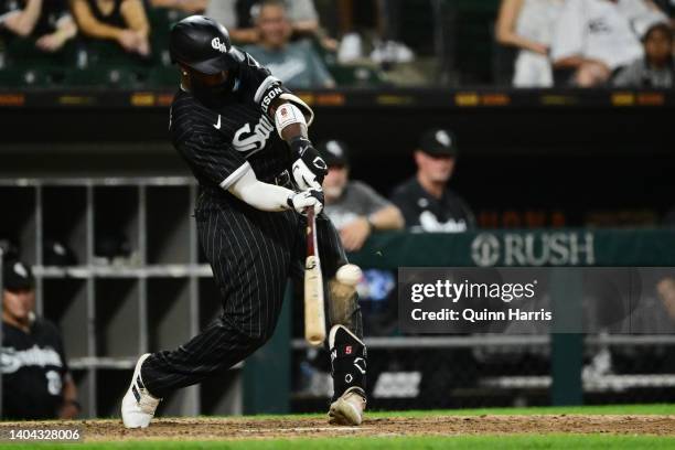 Josh Harrison of the Chicago White Sox hits a walk-off single to win the game 7-6 in the 12th inning against the Toronto Blue Jays at Guaranteed Rate...