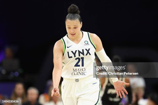 Kayla McBride of the Minnesota Lynx reacts after a three-point shot against the Phoenix Mercury during the second half of the WNBA game at Footprint...