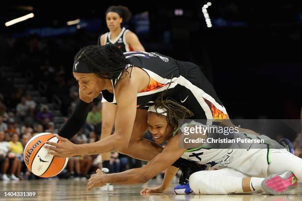 Shey Peddy of the Phoenix Mercury dives for a loose ball against Moriah Jefferson of the Minnesota Lynx during the second half of the WNBA game at...
