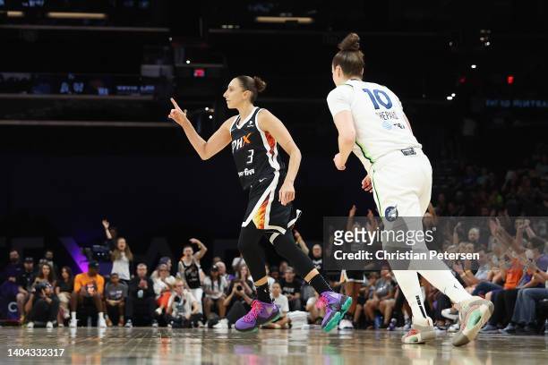 Diana Taurasi of the Phoenix Mercury reacts after a three-point shot over Jessica Shepard of the Minnesota Lynx during the second half of the WNBA...