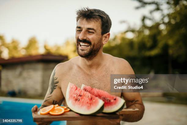 fruit plate taste good - fat guy on beach bildbanksfoton och bilder