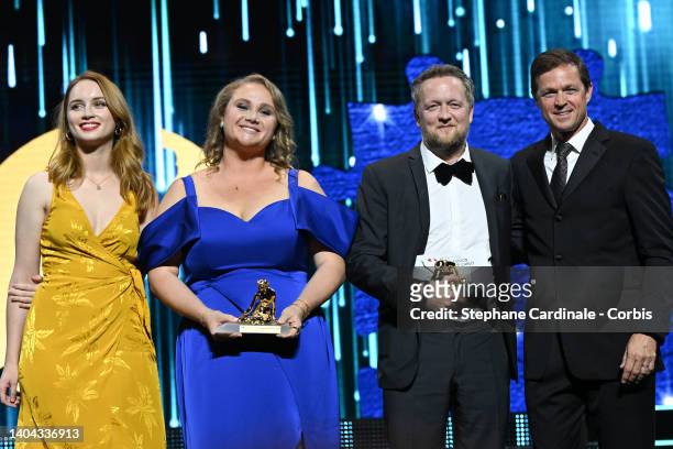 Catriona Renton, Danielle MacDonald and Producer Harry Williams pose with the Best Series Award and the Best Creation Award for 'The Tourist' next to...