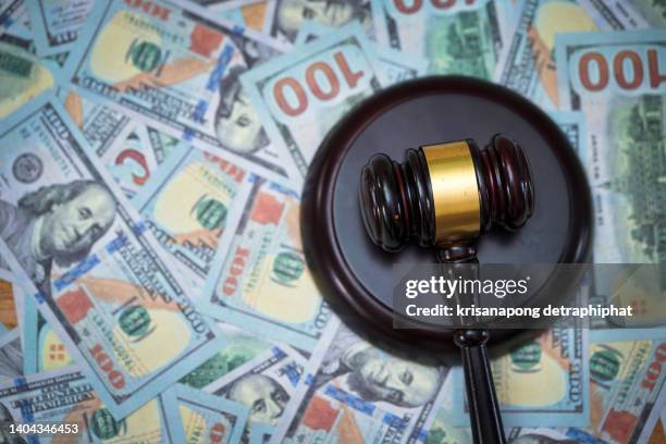 money and hammer,wooden gavel and dollar banknotes - tax penalty stock pictures, royalty-free photos & images