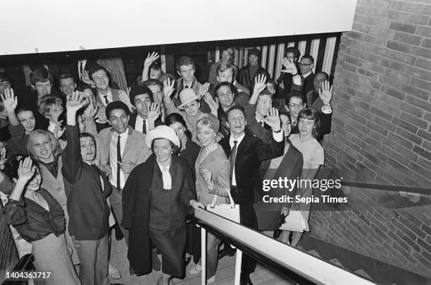 The Dutch National Ballet departs from Schiphol Airport for South America, Sonia Gaskell amidst dancers, April 8, 1966.