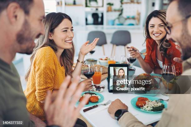 video call between friends during a party - zoom dinner stock pictures, royalty-free photos & images