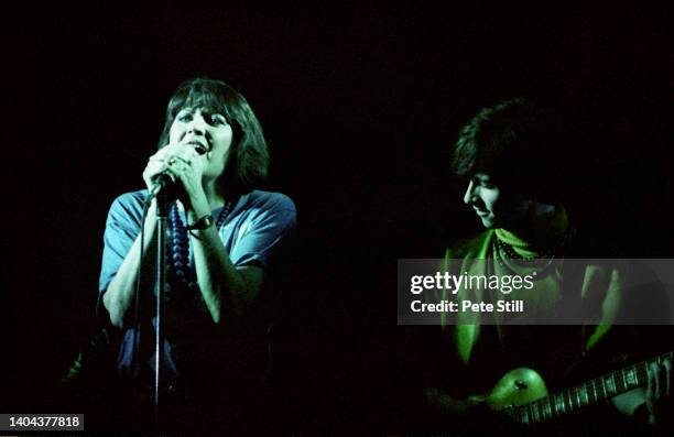 English singer Sandie Shaw appears with guitarist Johnny Marr of The Smiths on stage at Hammersmith Palais, on March 12th, 1984 in London, England.