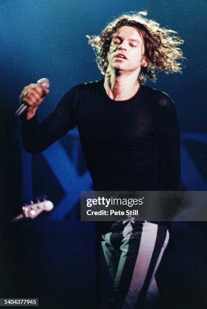 Michael Hutchence of INXS performs on stage at Wembley Stadium on July 13th, 1991 in London, England.