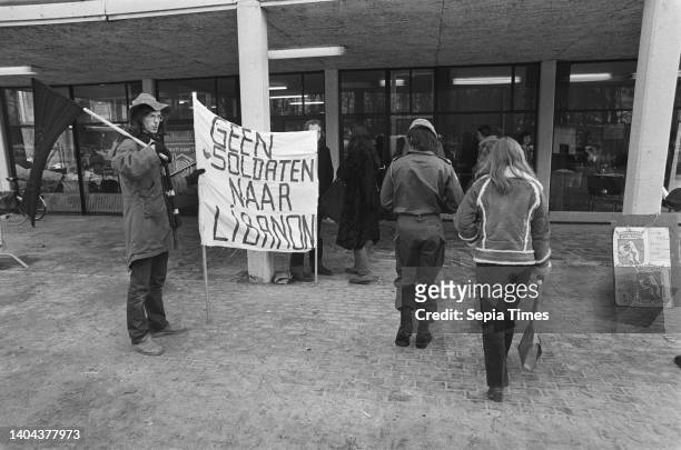 Demonstrators at the gathering; a banner bears the text No soldiers to Lebanon, February 26 demonstrators, military, banners, The Netherlands, 20th...
