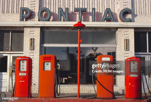 Four gas pumps, Weld County Garage, Rt 85, Greeley, Colorado; ca. 1980.