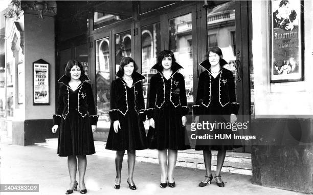 Usherettes standing in the doorway of the New Strand Theatre, Liverpool Street, Hobart - Mandatory Photo Credit: TAHO.