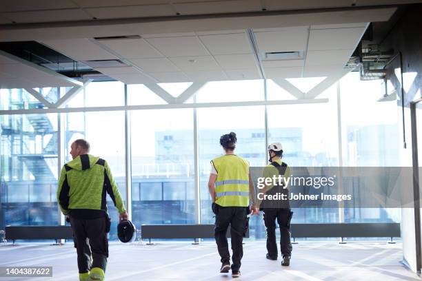 workers at building site - site visit stock pictures, royalty-free photos & images