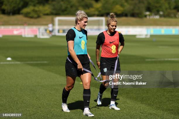 Millie Bright and Rachel Daly of England look on during an England women Training session at St George's Park on June 21, 2022 in Burton upon Trent,...