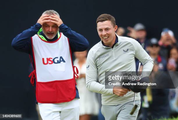 Matt Fitzpatrick of England celebrates with caddie Billy Foster after winning on the 18th green during the final round of the 122nd U.S. Open...