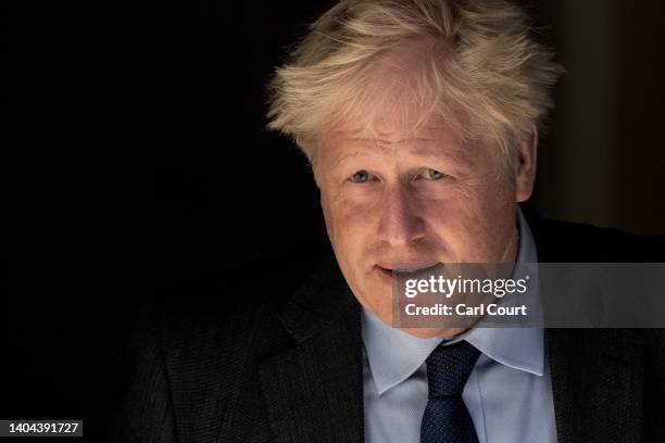 Britain's Prime Minister, Boris Johnson, leaves 10, Downing Street to attend Prime Minister's Questions in the House of Commons on June 22, 2022 in...