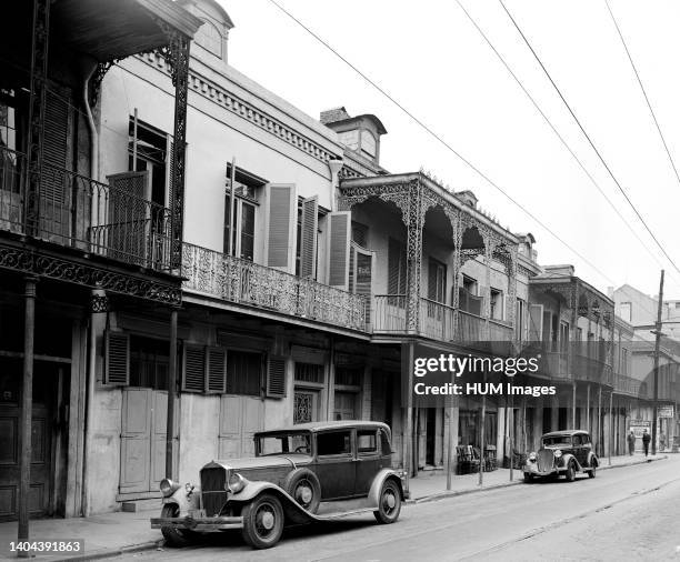 Cars parked in the street in 1930s New Orleans; 1935.