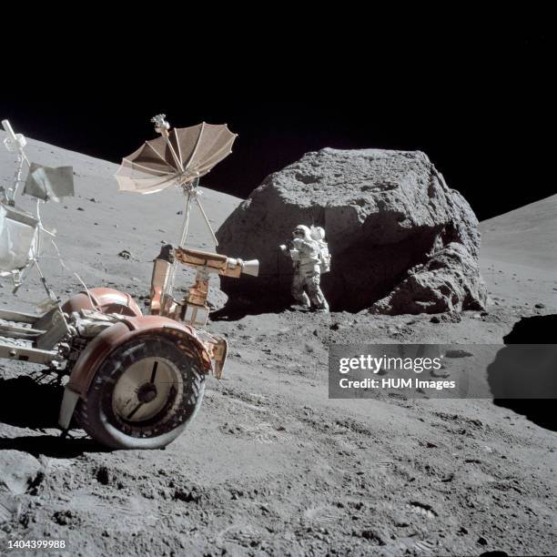 --- Scientist-astronaut Harrison H. Schmitt is photographed working beside a huge boulder at Station 6 during the third Apollo 17 extravehicular...
