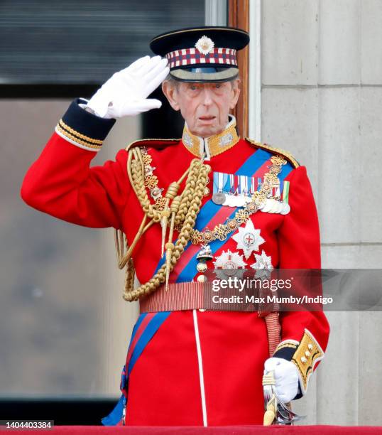 Prince Edward, Duke of Kent salutes as he accompanies Queen Elizabeth II as she takes a salute from the balcony of Buckingham Palace during Trooping...