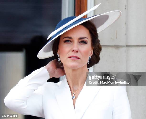 Catherine, Duchess of Cambridge watches a flypast from the balcony of Buckingham Palace during Trooping the Colour on June 2, 2022 in London,...