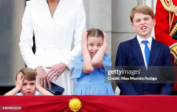Prince Louis of Cambridge, Princess Charlotte of Cambridge and Prince George of Cambridge watch a flypast from the balcony of Buckingham Palace...