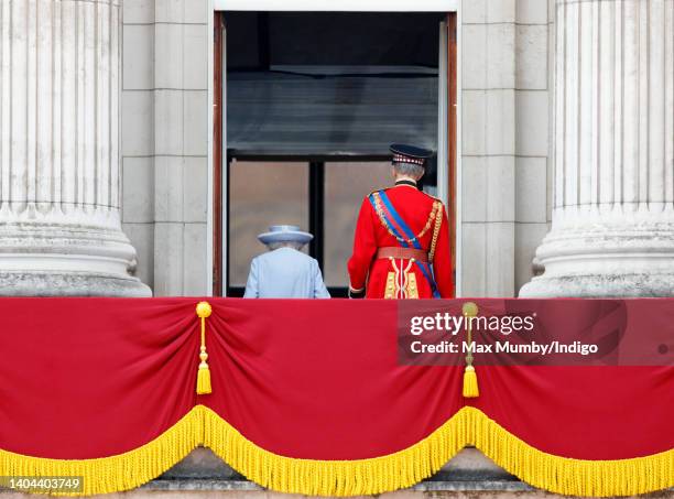 Queen Elizabeth II accompanied by Prince Edward, Duke of Kent takes a salute from the balcony of Buckingham Palace during Trooping the Colour on June...