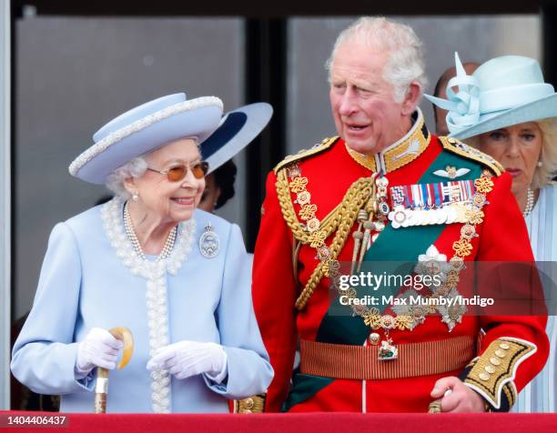 Queen Elizabeth II and Prince Charles, Prince of Wales watch a flypast from the balcony of Buckingham Palace during Trooping the Colour on June 2,...