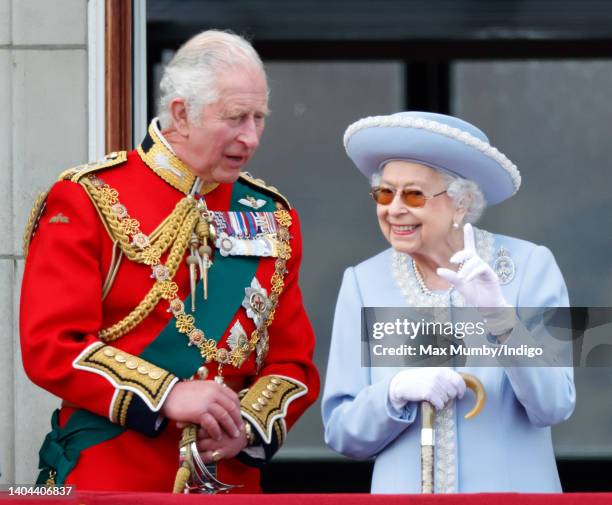 Prince Charles, Prince of Wales and Queen Elizabeth II watch a flypast from the balcony of Buckingham Palace during Trooping the Colour on June 2,...