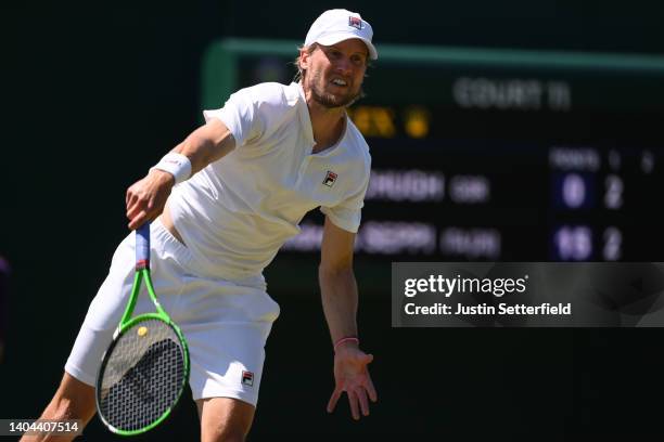 Andreas Seppi of Italy serves against Aidan McHugh of Great Britain in their Mens' Qualifying Singles match during Day 3 of Wimbledon Championships...