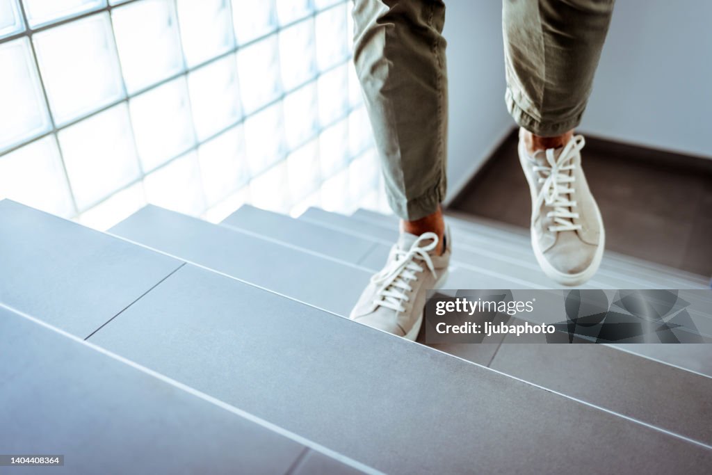 Businessman ascending office stairs