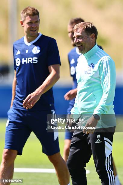 Simon Terodde and head coach Frank Kramer react during the training session at Parkstadion on June 22, 2022 in Gelsenkirchen, Germany. FC Schalke 04...