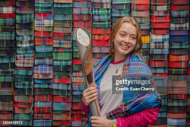 Baton bearer Alice Milivoyevich wears the Commonwealth games - Team Scotland 2022 tartan at Lochcarron of Scotland visitor centre, during the...