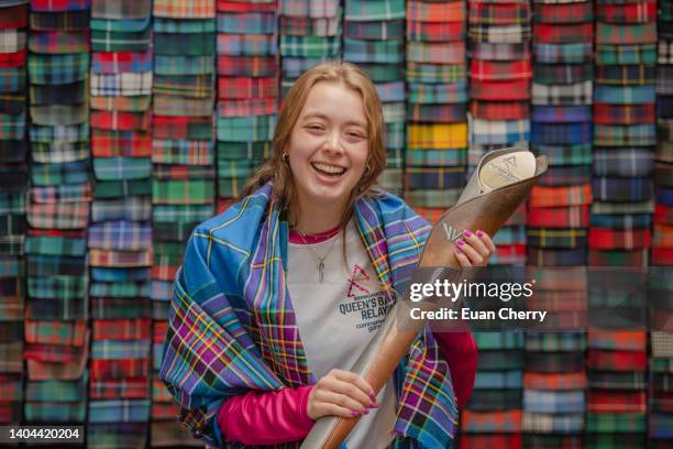 Baton bearer Alice Milivoyevich wears the Commonwealth games - Team Scotland 2022 tartan at Lochcarron of Scotland visitor centre, during the...